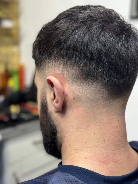 Mid fade seen from the back, blended into the neckline
