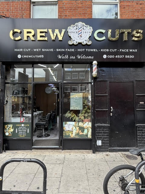 The Crew Cuts shopfront on Mare Street, gold lettering on black