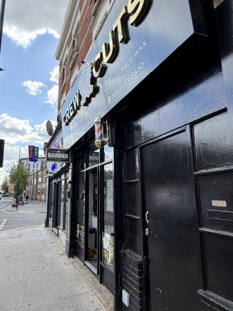 The shopfront seen along Mare Street